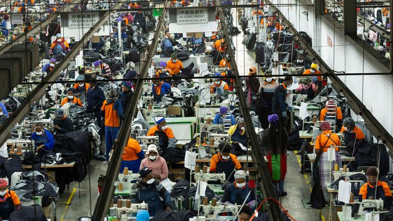 Workers at the Nien Hsing International Garment's Factory produce Levi jeans for the US market in Maseru, Lesotho