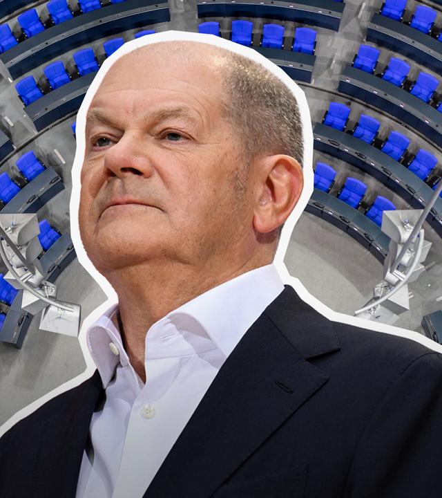 Olaf Scholz, im Hintergrund Bundestag