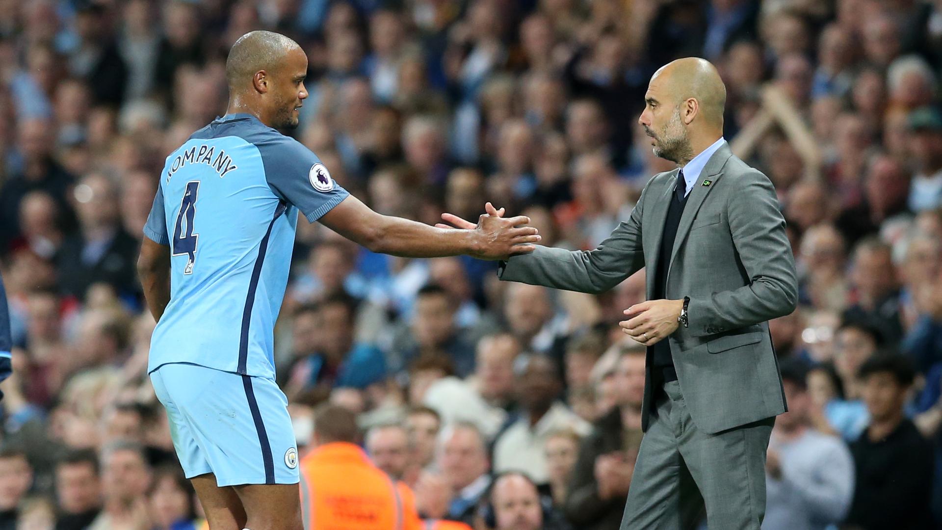 Vincent Kompany und Trainer Pep Guardiola 