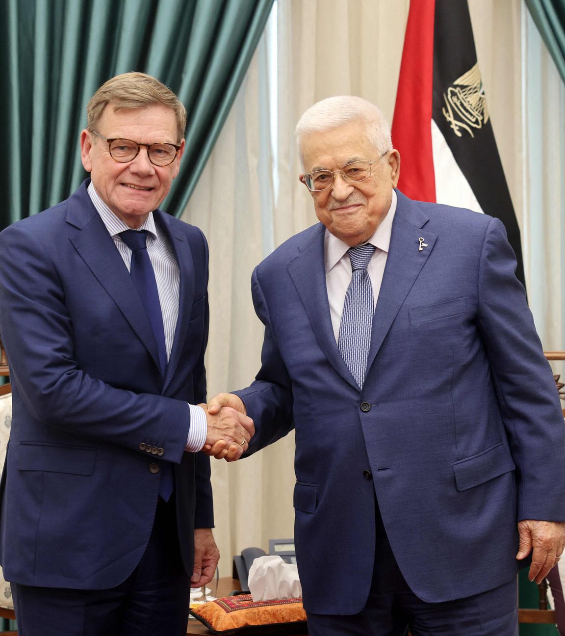 This handout picture released by the Palestinian press office (PPO) shows President Mahmud Abbas (R) meeting with German Foreign Minister Johann Wadephul in Ramallah in the Israel-occupied West Bank on August 1, 2025. 