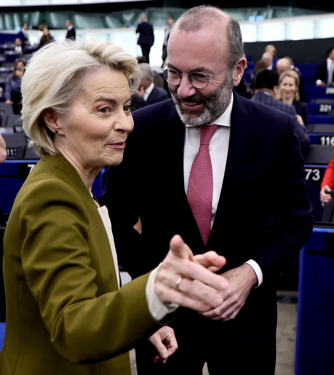 European Commission President Ursula von der Leyen (C-L) and European People's Party (EPP) group leader Manfred Weber (C-R) arrive for a 'State of the Union' debate at the European Parliament.