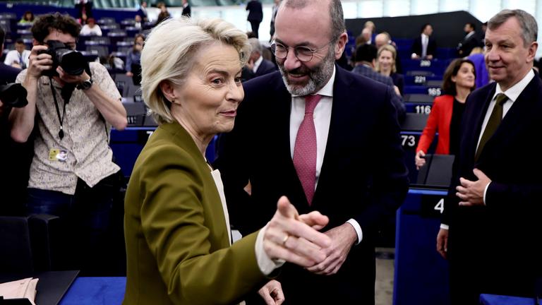 European Commission President Ursula von der Leyen (C-L) and European People's Party (EPP) group leader Manfred Weber (C-R) arrive for a 'State of the Union' debate at the European Parliament.
