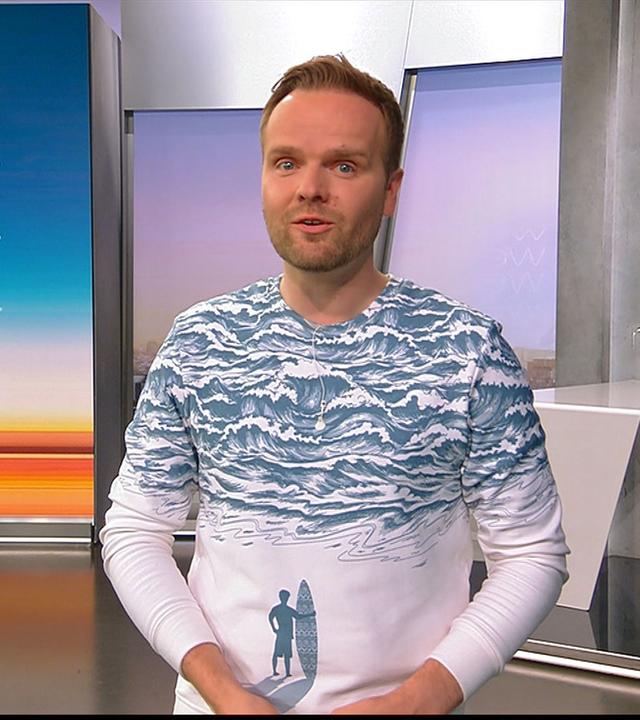 Benjamin Stöwe präsentiert das Wetter