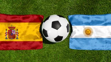 July 16, 2026: PHOTO MONTAGE, 2026 FIFA World Cup: National flags of Spain and Argentina with a soccer ball on the field. Illustrative image for the World Cup final on July 19 at the 2026 FIFA World Cup *** FOTOMONTAGE, Fußball-Weltmeisterschaft 2026: Nationalflaggen von Spanien und Argentinien mit Fußball auf Rasen. Symbolbild zum WM-Finale am 19 Juli bei der FIFA Fussball-Weltmeisterschaft 2026