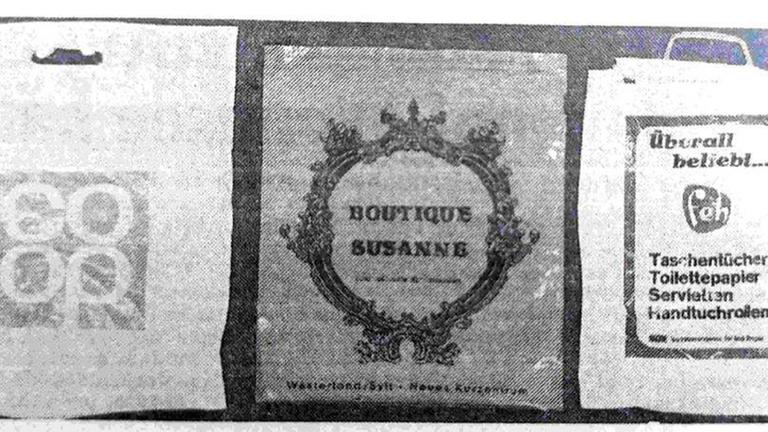 Drei Tragetaschen mit Logos von den Läden "Coop", "Boutique Susanne" und der Marke "Feh".