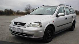 Gray Opel Caravan station wagon