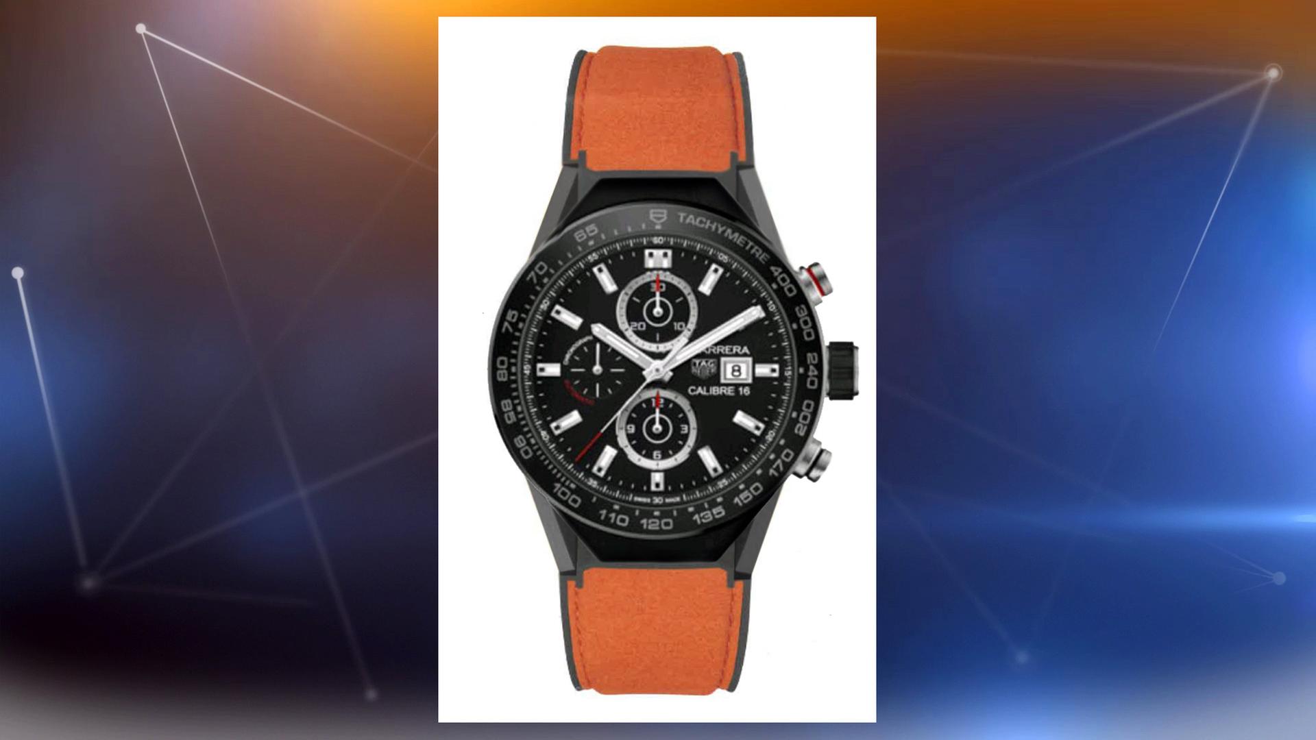 Individuell angefertigte Tag-Heuer-Uhr mit schwarzem Ziffernblatt und orangefarbenem Armband.