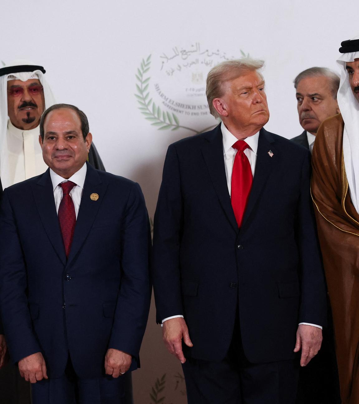 World leaders including Donald Trump, Abdel Fattah al-Sisi, Tayyip Erdogan and Emir Sheikh Tamim bin Hamad Al Thani pose for a family photo, at the Sharm El Sheikh Peace Summit in Egypt